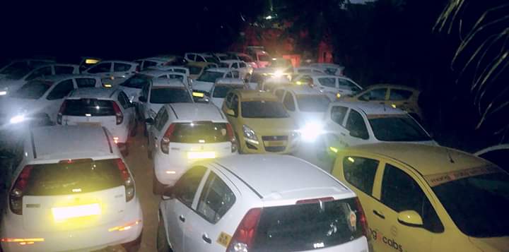 Mango Cabs yard — fleet at night